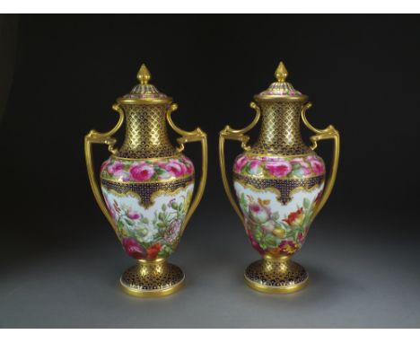 A pair of Copeland Spode twin-handled vases and covers painted with flowers and gilt by Thomas Sadler, printed factory mark, 