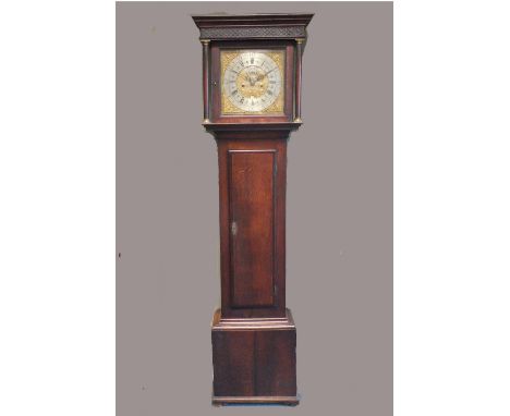 Peter Brisbourne, a George III oak and mahogany crossbanded cottage longcase clock, the square hood with blind fret carved fr