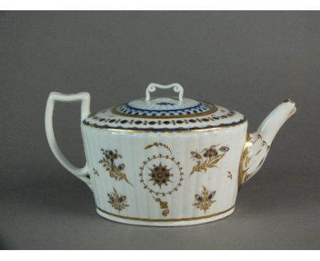 A Caughley teapot and cover painted in blue and gilt with a star-like motif, circa 1792-98, 11.5cm high (a.f) Provenance: Wri