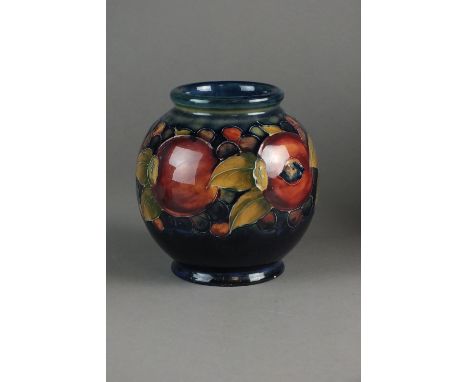 A Moorcroft globe form vase in the Pomegranate pattern, impressed and painted marks, 14cm high