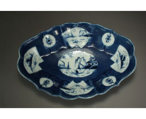 A Caughley powder blue oval form dessert dish painted with the Fan Panelled landscape design, circa 1777-85, faux Chinese mar