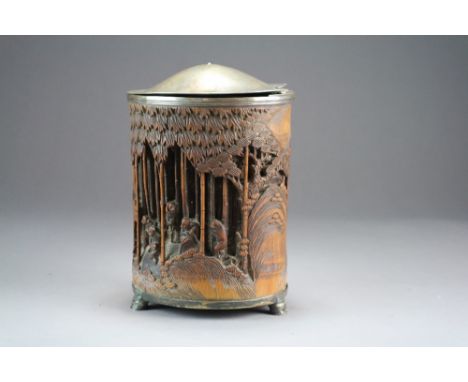 A Chinese carved bamboo brush pot, bitong, 19th Century, later adapted as a tea caddy, of cylindrical form and carved in reli