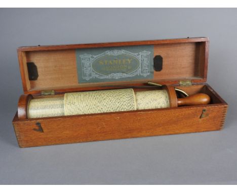 A Fuller's spiral slide rule calculator by W.F. Stanley, early 20th century in original mahogany box with green paper label t