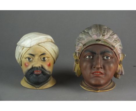 A mixed group of early 20th century tobacco jars, bisque and glazed (2)