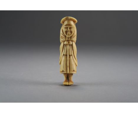A Japanese ivory netsuke, Edo period, carved as an elderly farmer standing and holding a bamboo cane, 7cm high.
