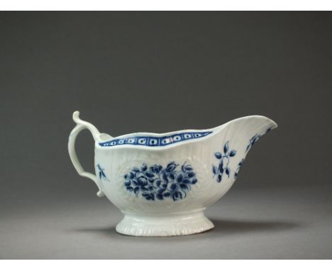 A Caughley sauce boat transfer-printed with the Fruit and Wreath pattern, circa 1777-85, 9.8cm high (cracked, chipped), a Cau