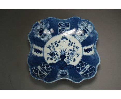 A Caughley powder blue square dessert dish in the Holed or Flaming Rock design, circa 1778-80, C mark, 20.5cm wide (chipped)