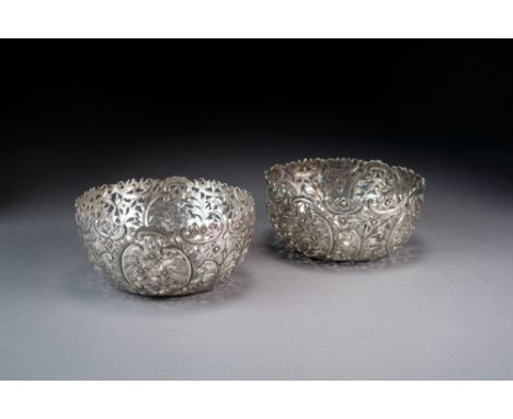 A pair of Chinese pierced silver bowls, Luen Wo, Shanghai circa 1900, of rounded form and chased with acanthus leaves, flower