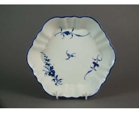 A Caughley teapot stand painted with the Chantilly Sprigs A pattern, circa 1786-92, unglazed base with S mark, 17cm wideProve