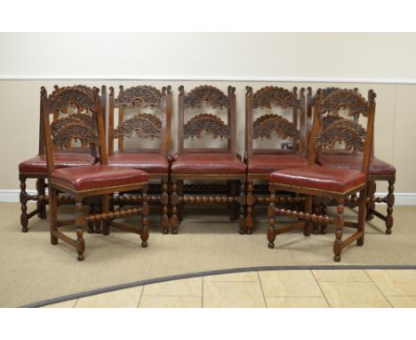 A set of one dozen 17th Century style Derbyshire oak Dining Chairs wirh scroll carved arched horizontal splats with turned dr
