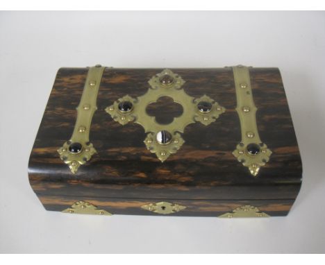 A 19th Century brass bound coromandel Games Box containg cribbage and other boards, whist markers, pointers, playing cards, e