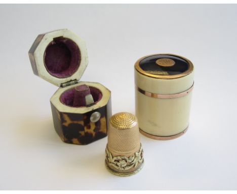 A 19th Century yellow metal Thimble with applied frieze of thistles and roses in octagonal tortoiseshell case and an ivory cy