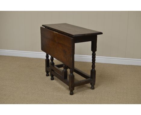 A late 17th Century oak Table with single dropleaf on bobbin turned supports with square stretchers, 2ft 9in