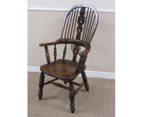 A 19th Century Windsor broad arm Elbow Chair in elm and beech with pierced splat and stick back, solid seat on turned legs an