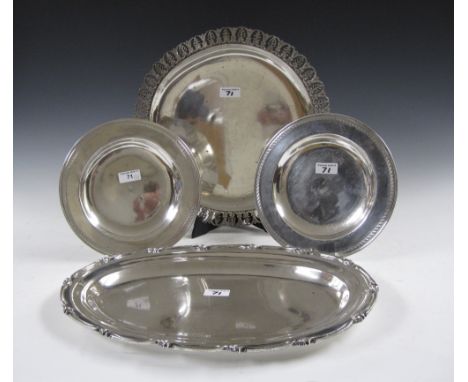 An Indian silver oval Platter, circular Platter and a pair of Salvers