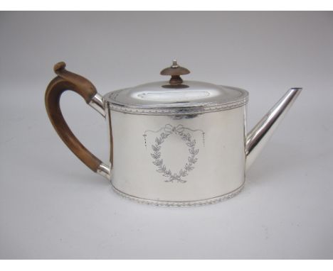 A George III silver oval Teapot with laurel wreath and ribbon vacant cartouche, London 1787, makers: Andrew Fogelberg and Ste