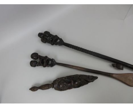A Mbunda carved wooden Staff surmounted by an embracing couple with bird to the shaft, and a Mbunda ceremonial wooden spatula