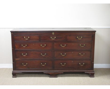 A Georgian mahogany Mule Chest with hinged top above dummy and four real drawers on ogee bracket feet, 5ft 11in W