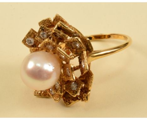 A Cultured Pearl and Diamond Cocktail Ring set central pearl within frame of square petals, some pavé-set brilliant-cut diamo