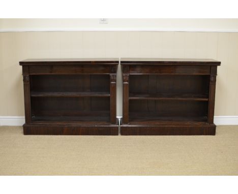 A pair of 19th Century rosewood open Bookcases, each with a rectangular top above a frieze drawer and adjustable shelf betwee