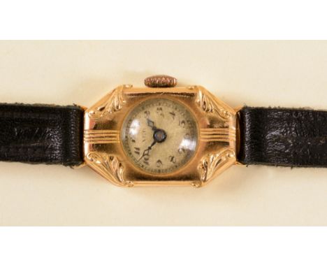 A Lady's manual Cocktail Watch the textured dial with arabic numerals in tonneau shaped 18ct gold case on black leather strap