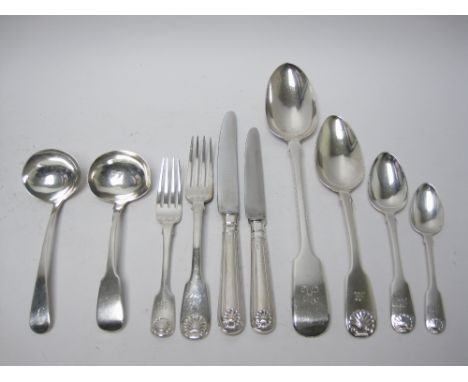 A matched set of silver Cutlery for twelve, fiddle and shell pattern, mostly engraved initial M, viz:12 Dinner Forks, London 