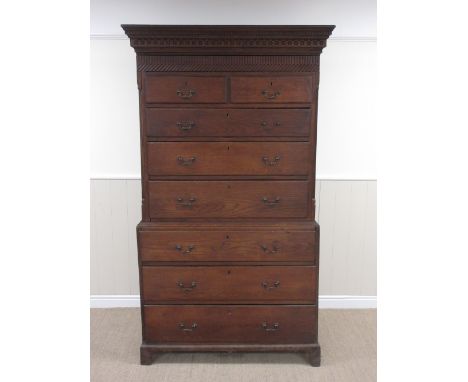 An 18th Century Welsh oak Chest on Chest with dentil and carved frieze above carved drawer, two short and six long drawers be