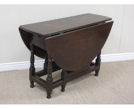 A late 17th Century oak oval Gate-leg Table on baluster turned and square supports united by square stretchers, 3ft 4in x 4ft