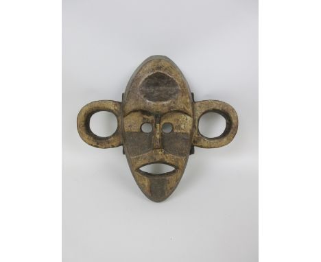 A Boa war Mask, wood with dark and light pigment, Upper Congo