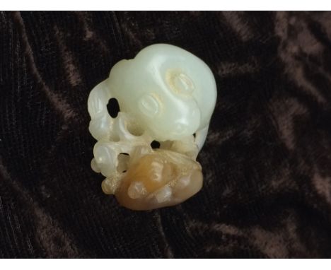 A Chinese jade Carving of a cat and kitten, pale celadon and caramel toned jade, 1 1/4 in D