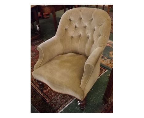 Victorian mahogany framed armchair with button back, upholstered in gold Dralon, front turned legs and casters  