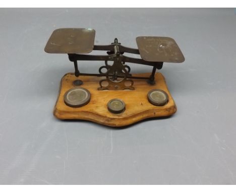 Pair of brass postal scales and part set of weights 