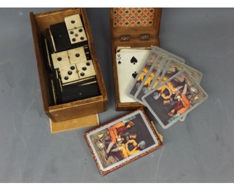 Pine box containing assorted ebonised and bone part set of dominoes together with a cribbage box and deck of cards (2) 