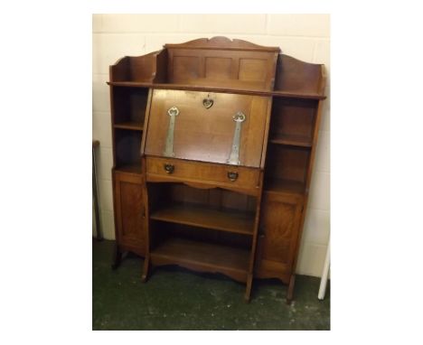Late 19th century/early 20th century Arts & Crafts style student type bureau bookcase with shelf above a drop down front with