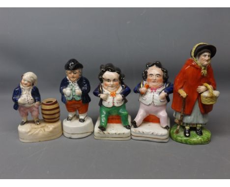 Group of 19th century Staffordshire wares to include a pepperette with cobalt blue jacket and black hat, a pair of seated fig