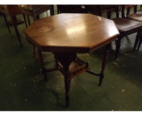 Edwardian American walnut occasional table of octagonal form with turned legs and four curved stretchers joining a galleried 