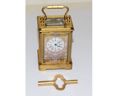 Brass cased miniature carriage clock with porcelain panels
