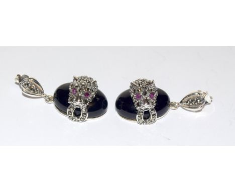 Pair of silver onyx and marcasite Cartier style panther earrings with ruby eyes