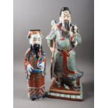 A Chinese porcelain figure of a warrior, seal mark to base, 17 1/2" high, and a similar smaller,