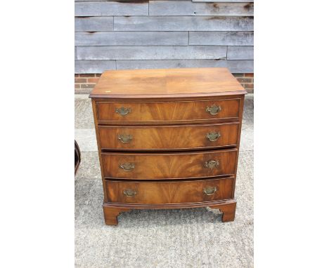 A figured mahogany bowfront chest of four long graduated drawers, on bracket feet, 31" wide x 19 1/2" deep x 33" high 