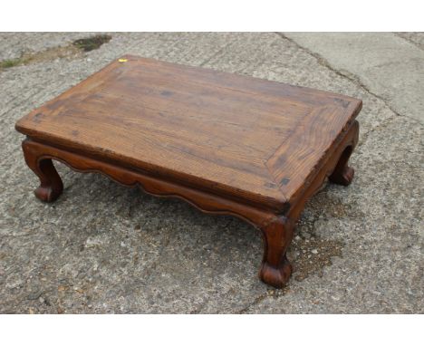 A Chinese elm low table, on scroll supports, 32" wide x 20" deep x 10" high 