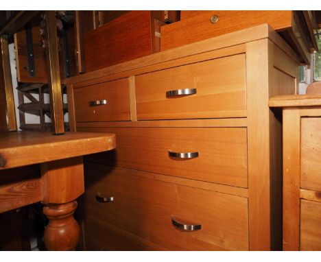A modern oak chest of two short and three long graduated drawers, on stile supports, 34" wide x 16" deep x 38" high, a modern