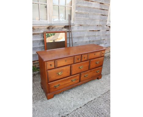 A Canadian maple sideboard, fitted two shallow, three deep and two long drawers, on bracket feet, 56" wide x 18" deep x 31" h