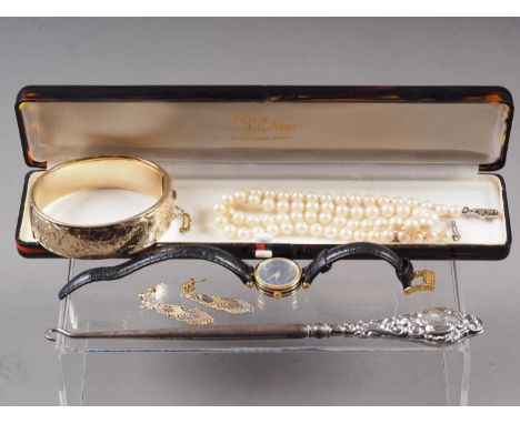 A rolled gold bangle, a silver handled button hook, a cultured pearl necklace, a lady's Gucci fashion watch and a pair of sil