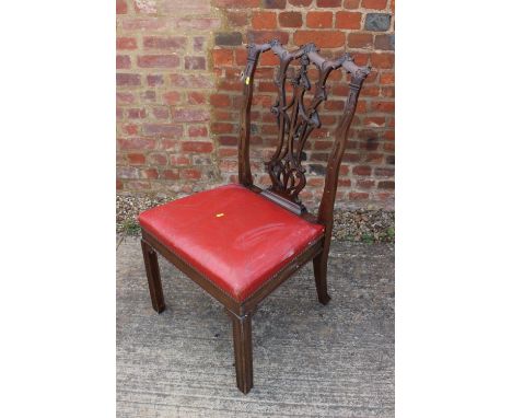 A mahogany side chair of Chippendale design with Gothic pierced splat and drop-in seat, on moulded and champhered supports 