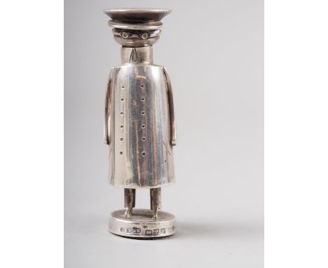 An Edwardian novelty silver pepper shaker, formed as a stylised chauffeur, by Saunders &amp; Shepherd Chester, 1908 