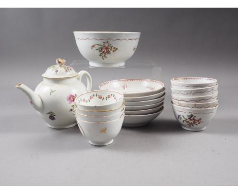 An 18th century Worcester teapot with floral spray decoration, similar tea bowls, saucers and a sugar bowl (damages) 
