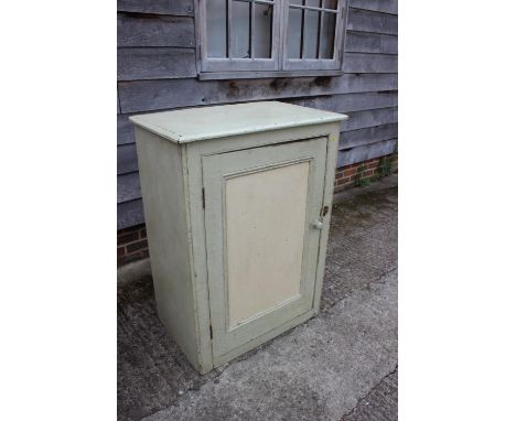 A light green and cream painted cupboard enclosed panel door, on block base, 30" wide x 20" deep x 44" high, and a hardwood b