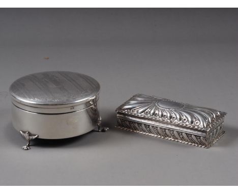 A circular silver dressing table box, with engine turned decoration, and a rectangular silver box, with engine turned decorat