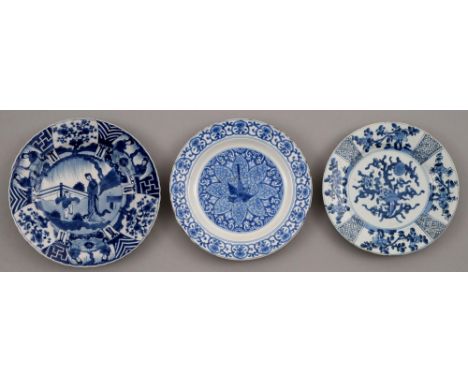 Three Chinese blue and white plates, Kangxi period, painted with a lady and jumping boy or other designs, 22-23.5cm diam, art
